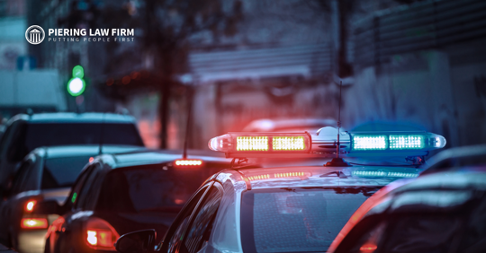 Police car with siren in traffic