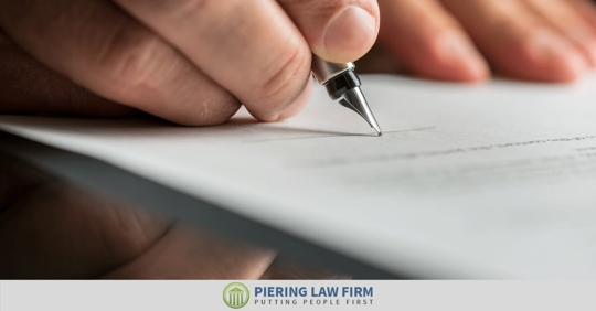 insurance adjuster signing settlement paper