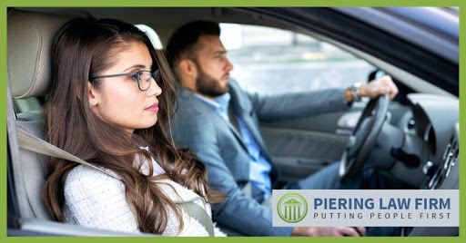 Man and woman driving together.