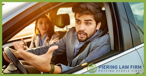 Angry male driver with female passenger