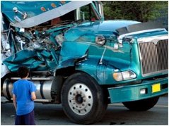 A teal semi truck after an accident